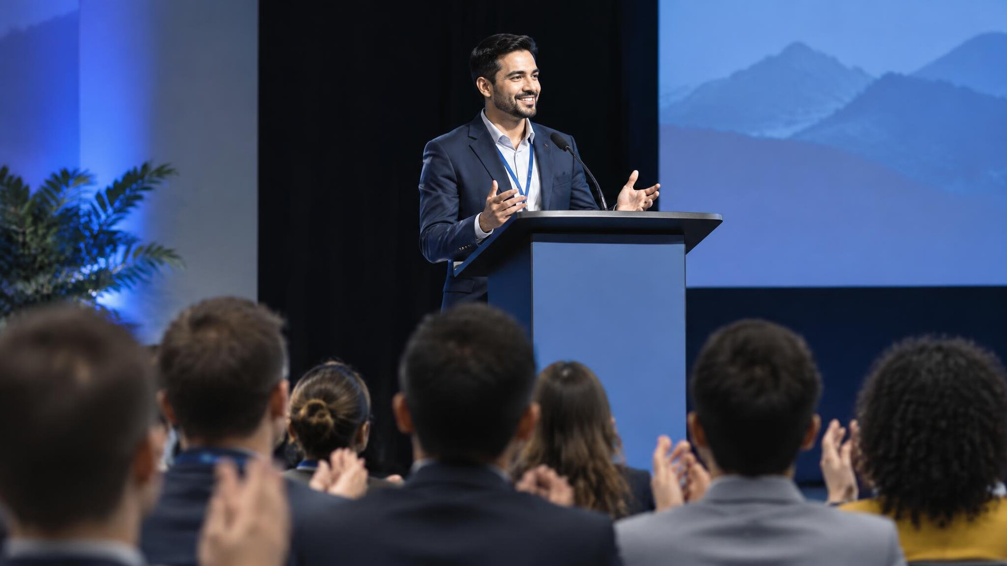 person giving speech on stage