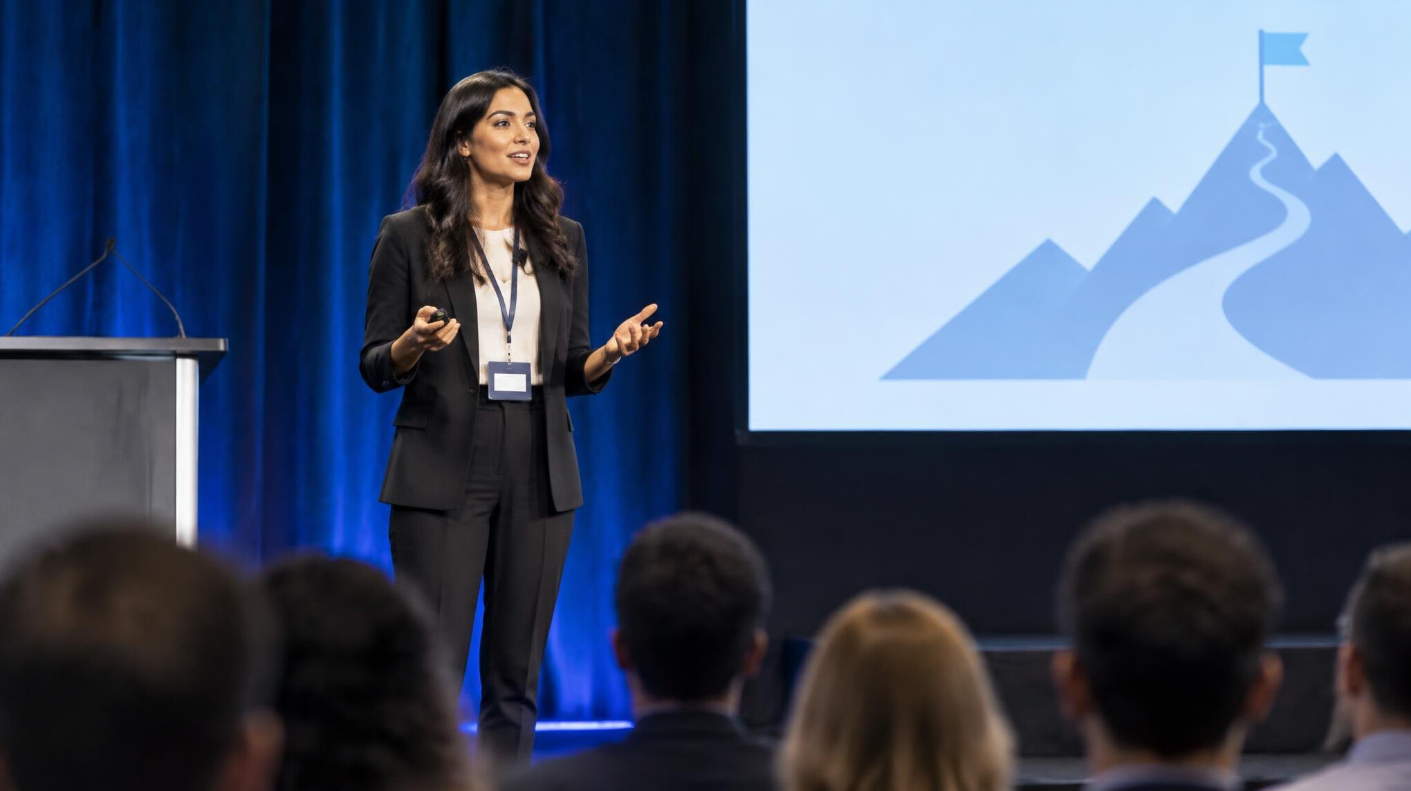 woman presenting to audience